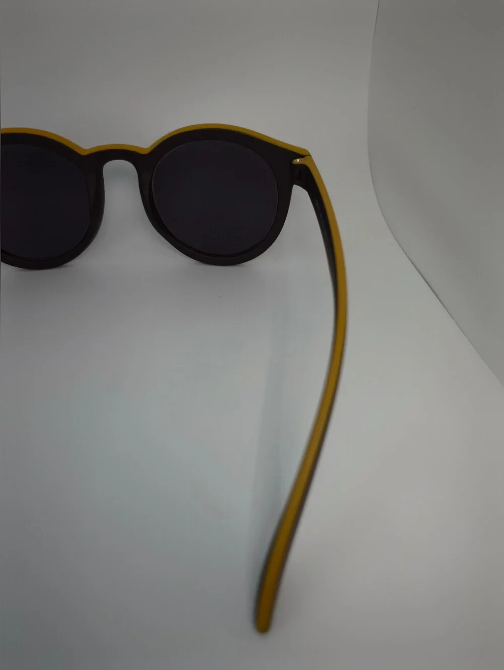 Oasis. Men's Black Round Frame. Deep Chocolate, Yellow Top.